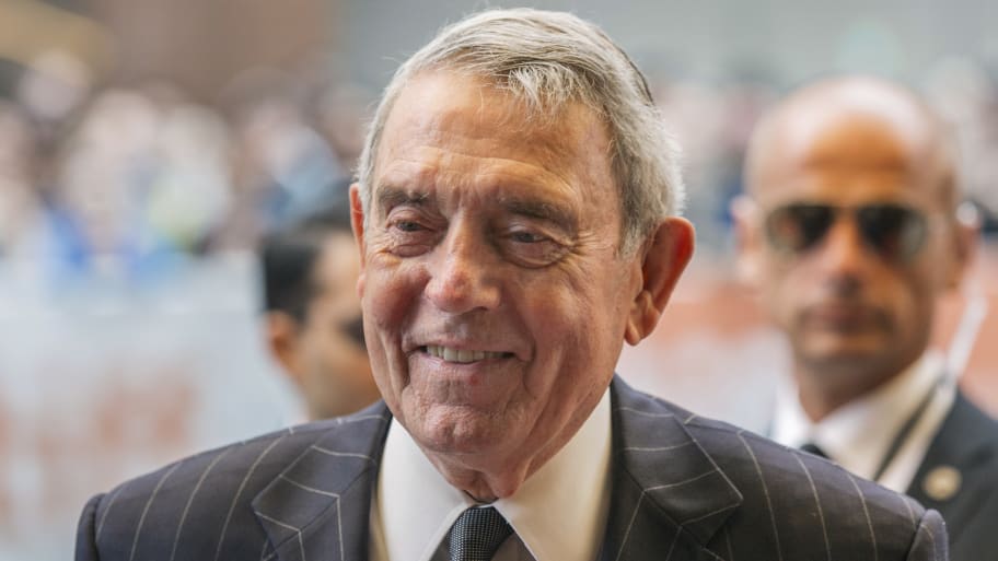 Dan Rather smiles outside a movie premiere for Truth.
