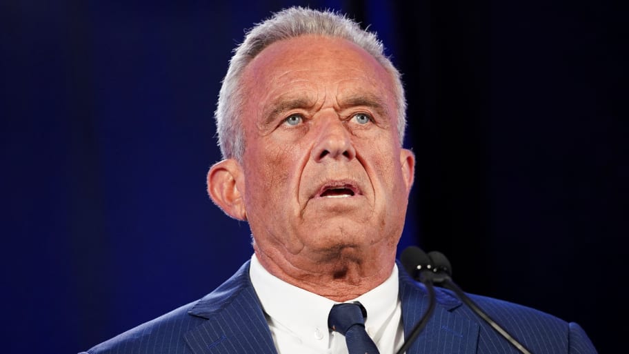 Robert F. Kennedy Jr. speaks from a podium on stage.