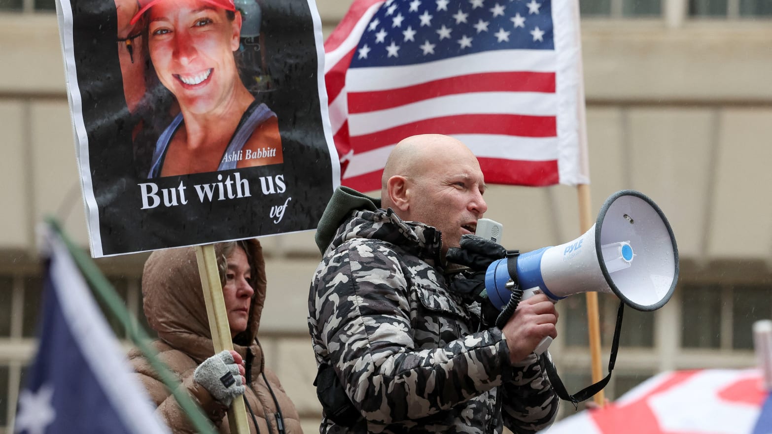 Right-wing conspiracy theorist Ivan Raiklin attends a rally in support of Jan. 6 insurrections