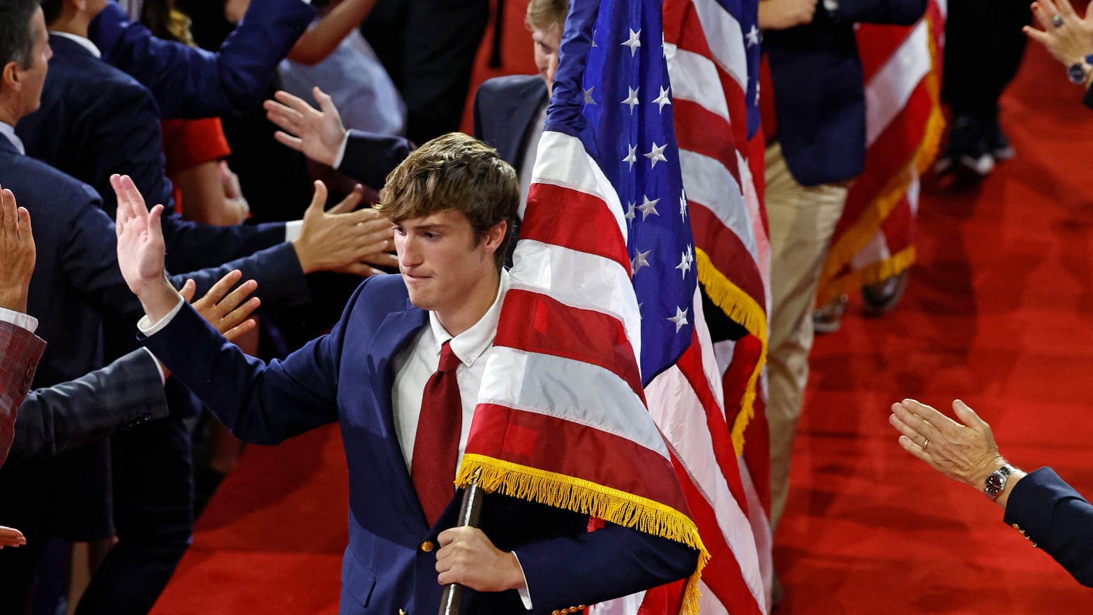 University of North Carolina at Chapel Hill fraternity brothers holding US national flags