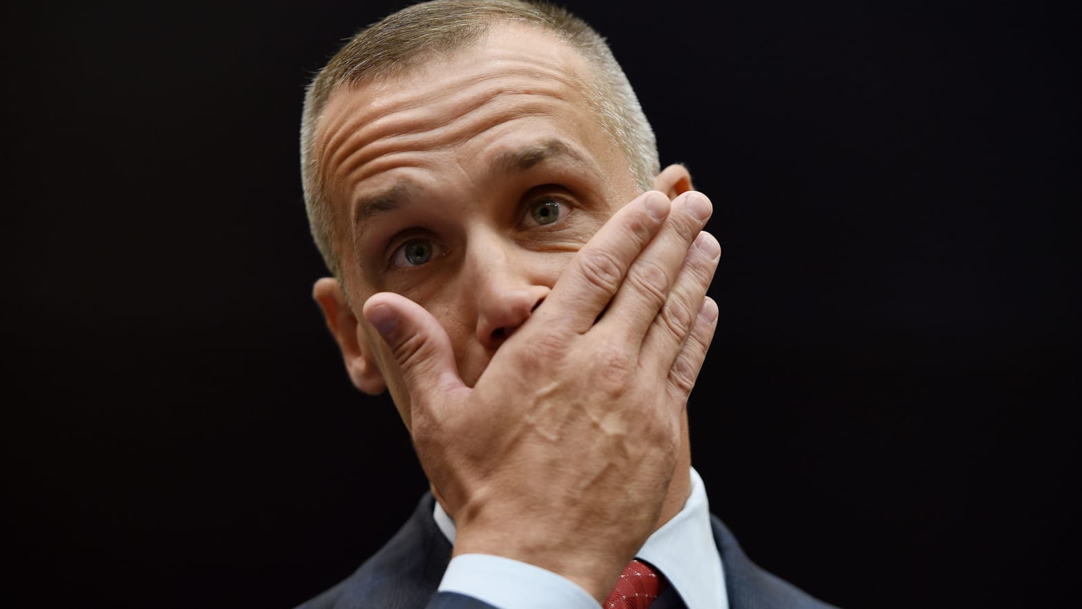 President Donald Trump's former campaign manager, Corey Lewandowski, looks on and covers his mouth with his hand before testifying before the House Judiciary Committee.