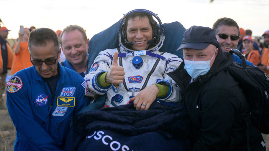 International Space Station (ISS) crew member and NASA astronaut Frank Rubio is carried by specialists shortly after landing in the Soyuz MS-23 space capsule.