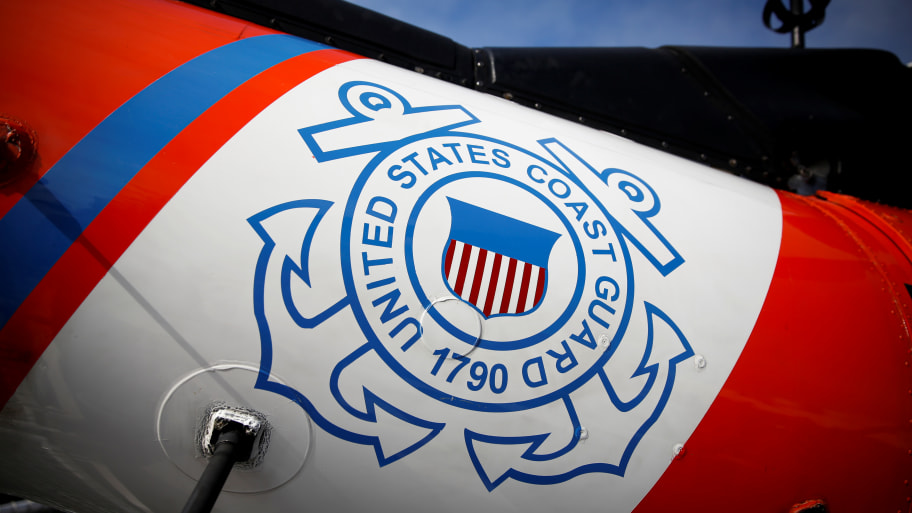 U.S. Coast Guard's logo is seen on a helicopter on the deck