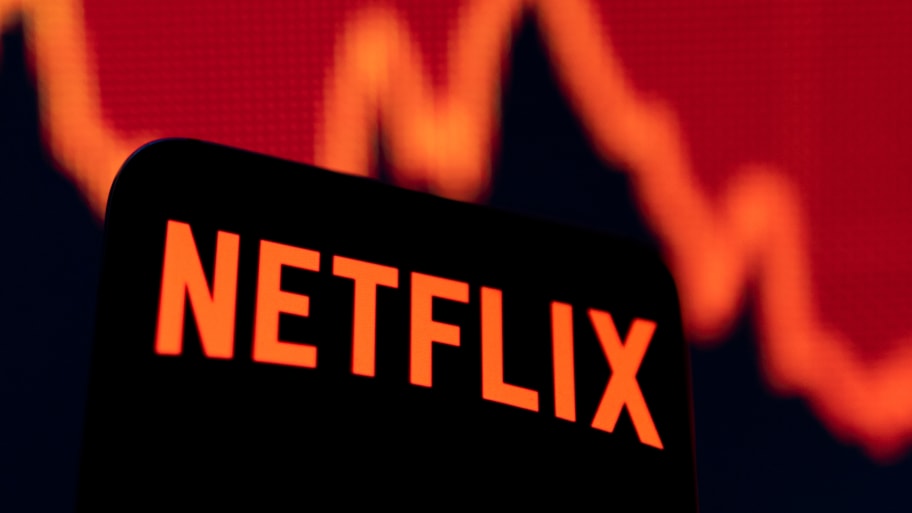 Smartphone with Netflix logo is seen in front of a descending stock graph in this illustration taken April 19, 2022.