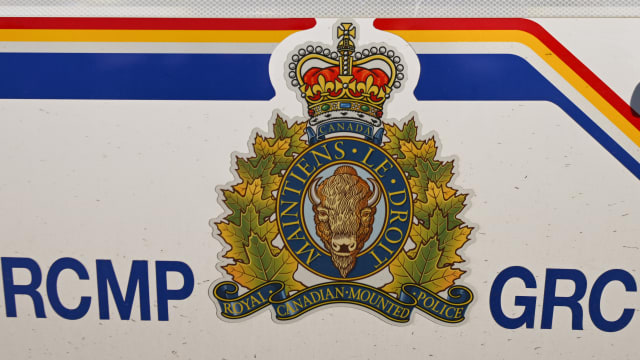 A symbol of the RCMP seen on a side of a RCMP vehicle
