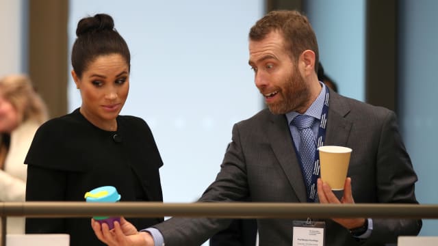 Meghan, Duchess of Sussex looking at reusable coffee cups back in 2019.