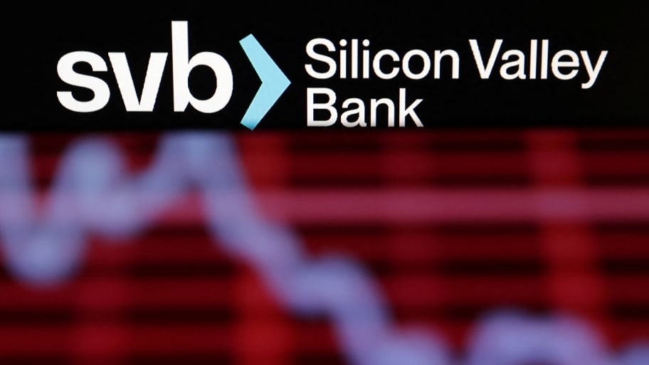An illustration shows the Silicon Valley Bank logo on top of a crashing stock chart