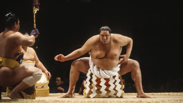 Akebono Taro, born in Hawaii as Chad Rowan, performs a ritual prior to a match in the 1993 San Jose Basho sumo wrestling tournament held June 4-5, 1993 at the San Jose Event Center in San Jose, California. 
