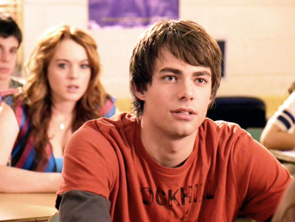 Lindsay Lohan looks at Jonathan Bennett in a classroom in a still from ‘Mean Girls’