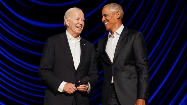President Joe Biden and former President Barack Obama share a laugh during a star-studded campaign fundraiser at the Peacock Theater in Los Angeles, California, June 15, 2024.