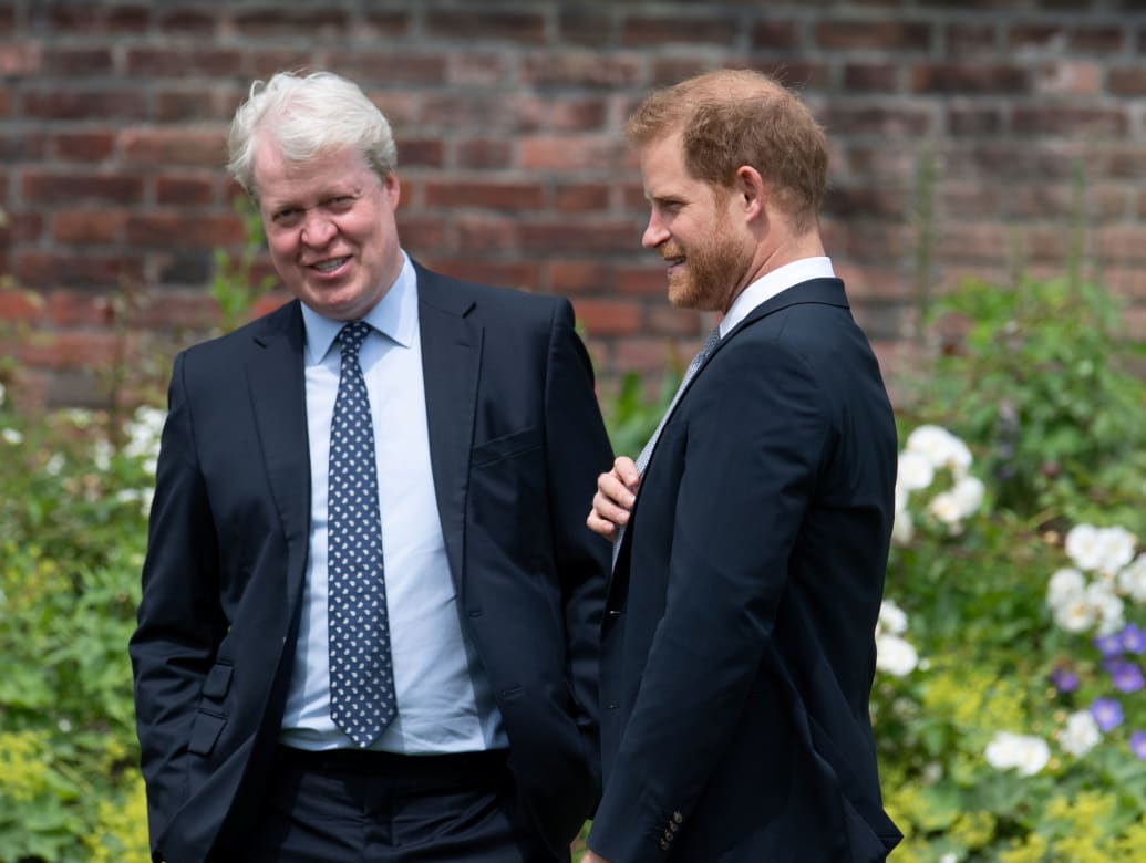 Prince Harry, Duke of Sussex, talks with his uncle Charles Spencer, 9th Earl Spencer, during the unveiling of a statue commissioned of his mother Diana, Princess of Wales, in the Sunken Garden at Kensington Palace, London, Britain July 1, 2021.