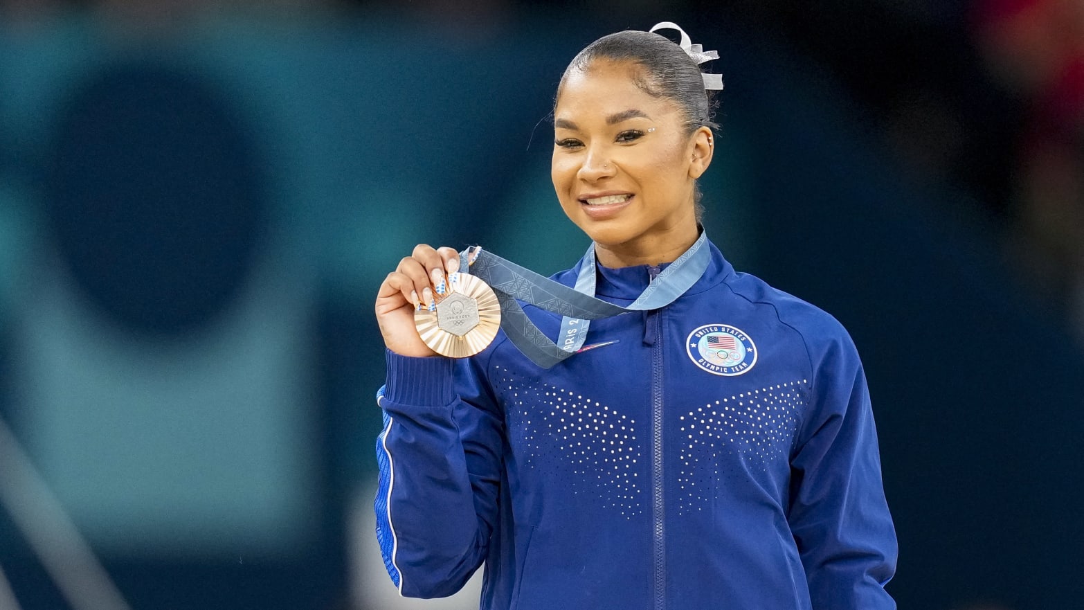 Jordan Chiles holding her bronze medal during the Olympic Games in Paris. 