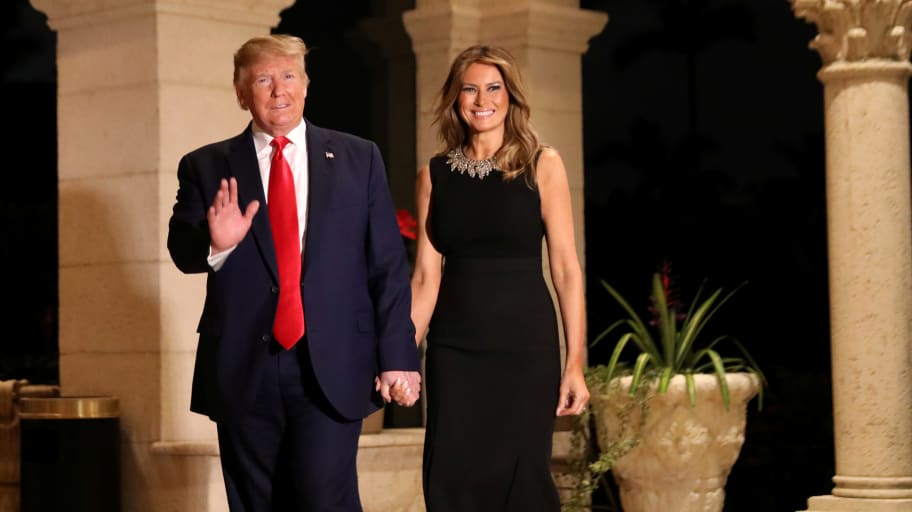 U.S. President Donald Trump and First Lady Melania Trump arrive to their Christmas Eve party at Trump's Mar-a-Lago resort in Palm Beach, Florida.