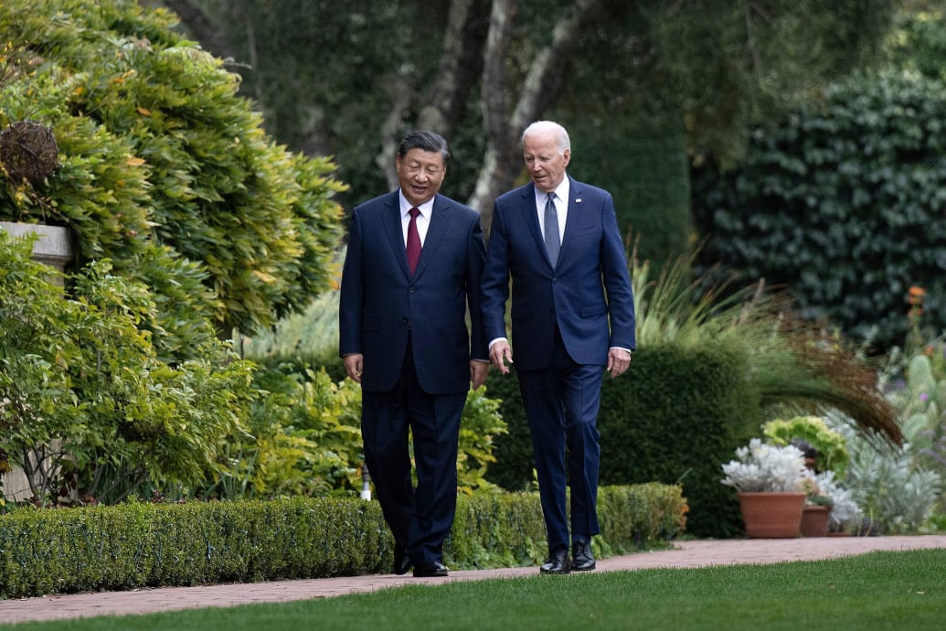A photograph of US President Joe Biden (R) and Chinese President Xi Jinping walking together after a meeting during the Asia-Pacific Economic Cooperation (APEC) Leaders' week