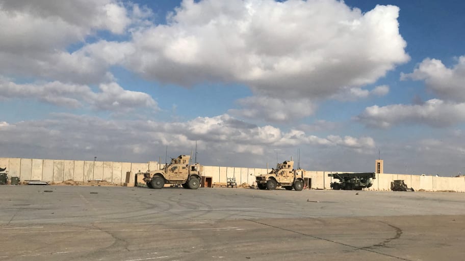 Military vehicles of U.S. soldiers are seen at the al-Asad air base in Anbar province, Iraq, 
