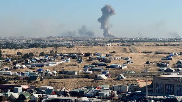 Smoke rises during an Israeli ground operation in Khan Younis as seen from a tent camp sheltering displaced Palestinians in Rafah.