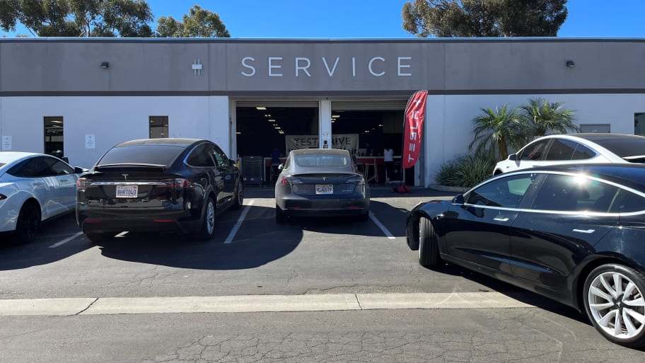 A Tesla electric sedan is pulling into a Tesla service center in the Kearny Mesa region, in San Diego, California