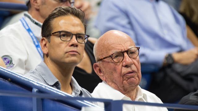 Lachlan Murdoch and his dad Rupert watch a tennis match together.