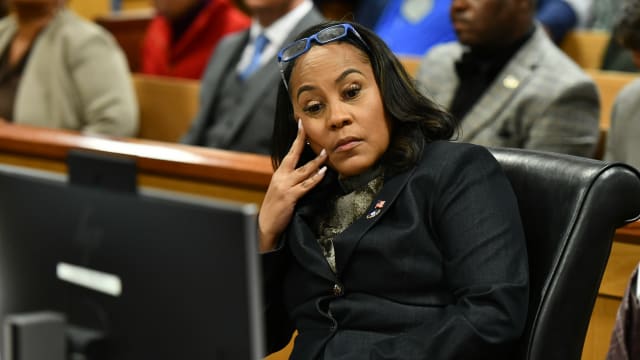 Fulton County District Attorney Fani Willis appears before Judge Scott McAfee for a hearing in the 2020 Georgia election interference case at the Fulton County Courthouse.