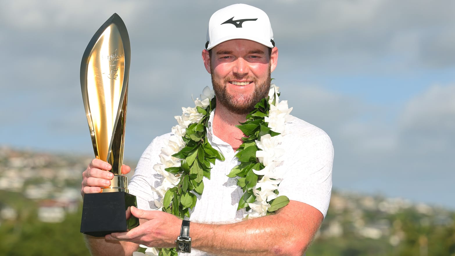 Grayson Murray of the United States poses with the trophy after winning the Sony Open in Hawaii in January.