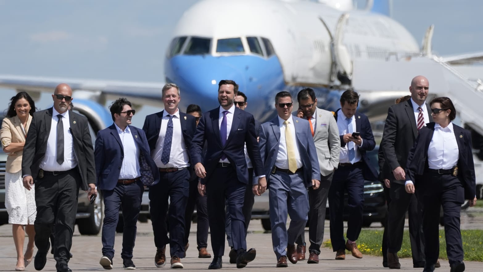 Republican vice presidential nominee Sen. JD Vance walks back from looking at Air Force Two.