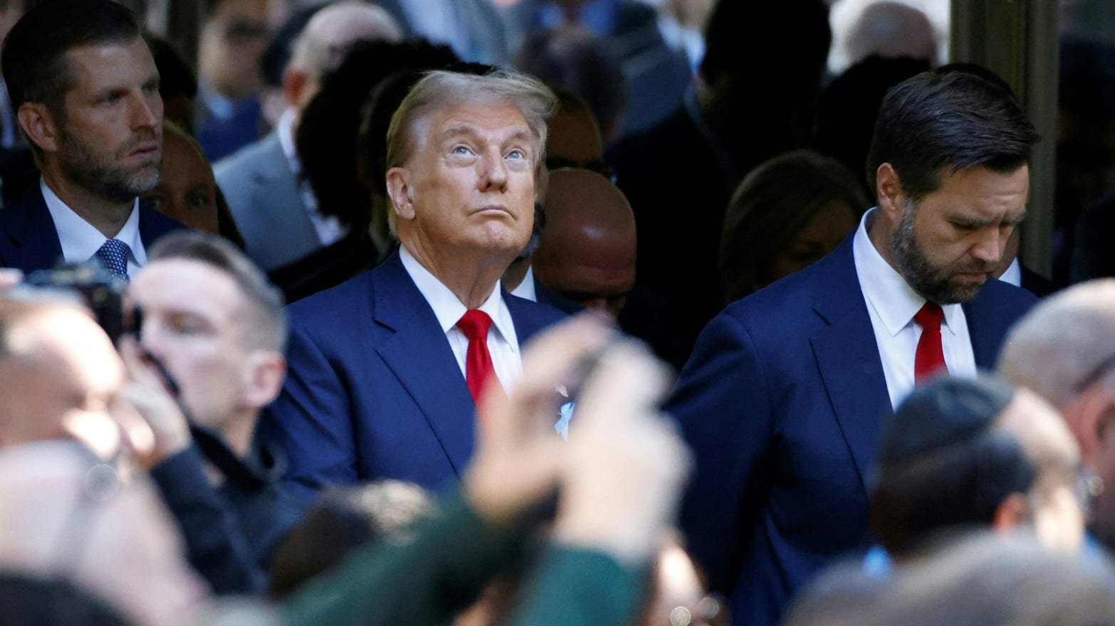 Former U.S. President and Republican presidential candidate Donald Trump (C) attends a remembrance ceremony on the 23rd anniversary of the September 11 terror attack on the World Trade Center at Ground Zero, in New York City