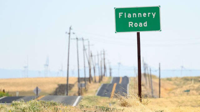 A road sign is posted near a parcel of land recently purchased by Flannery Associates near Rio Vista, California on September 15, 2023. 