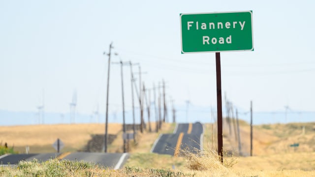 A road sign is posted near a parcel of land recently purchased by Flannery Associates near Rio Vista, California