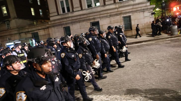 NYPD officers in riot gear march onto Columbia University campus