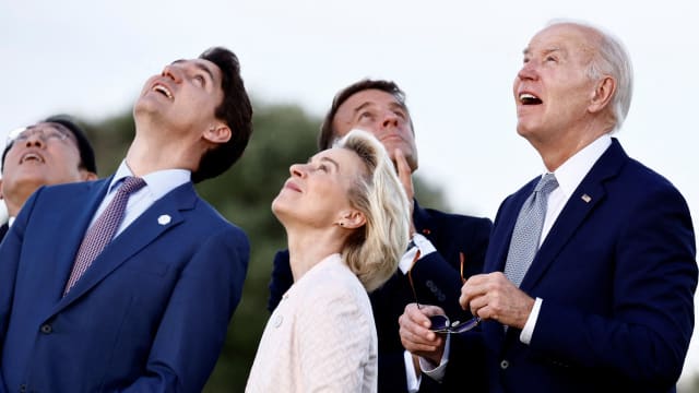 U.S. President Joe Biden looks on during a skydiving demonstration on the first day of the G7 summit, in Savelletri, Italy, June 13, 2024. 