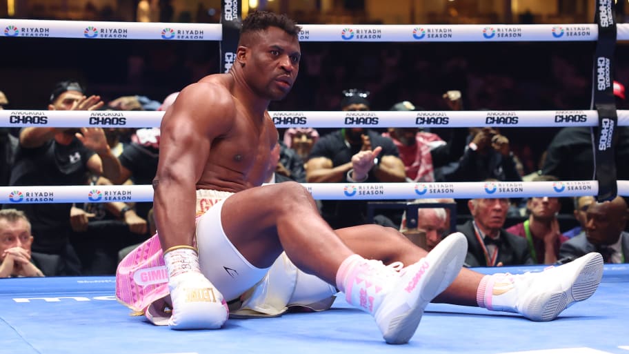 Francis Ngannou reacts after being knocked down by Anthony Joshua during a Heavyweight fight in Riyadh, Saudi Arabia.
