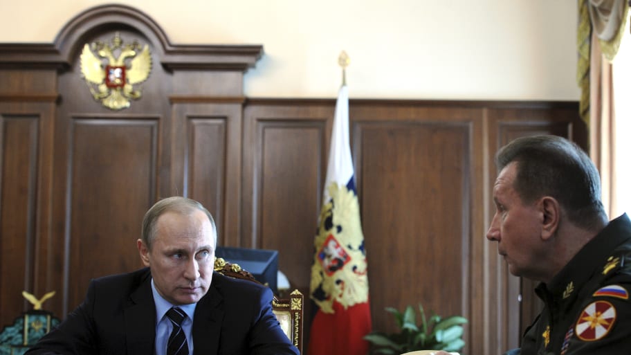 President Vladimir Putin (L) and Viktor Zolotov, appointed as the national guard head, attend a meeting dedicated to the creation of a national guard at the Kremlin in Moscow, Russia, April 5, 2016.