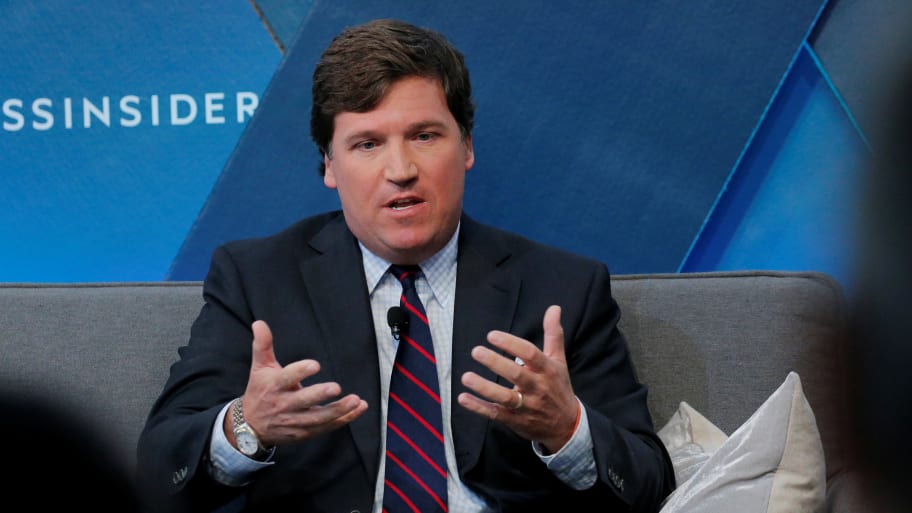 Tucker Carlson speaks at an event