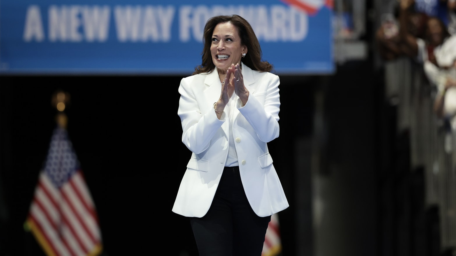 U.S. Vice President Kamala Harris greets the crowd as she arrives on stage at a campaign rally at the Enmarket Arena August 29, 2024 in Savannah, Georgia.