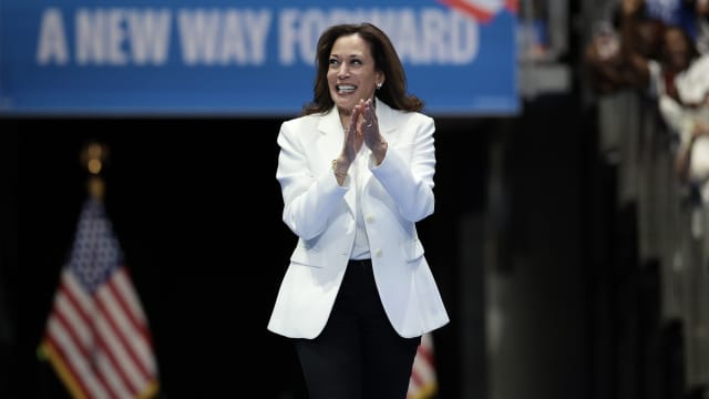 U.S. Vice President Kamala Harris greets the crowd as she arrives on stage at a campaign rally at the Enmarket Arena August 29, 2024 in Savannah, Georgia.