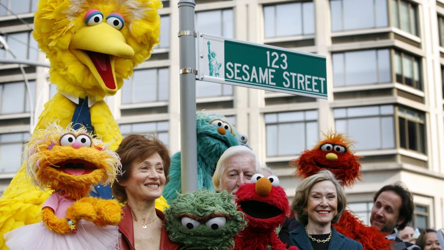 Sesame Street creator Joan Ganz Cooney poses with some of the cast during a 40th anniversary street naming celebration in New York, November 9, 2009. Sesame Street’s Twitter account joined in on dunking on Elon Musk’s rebranding to X.
