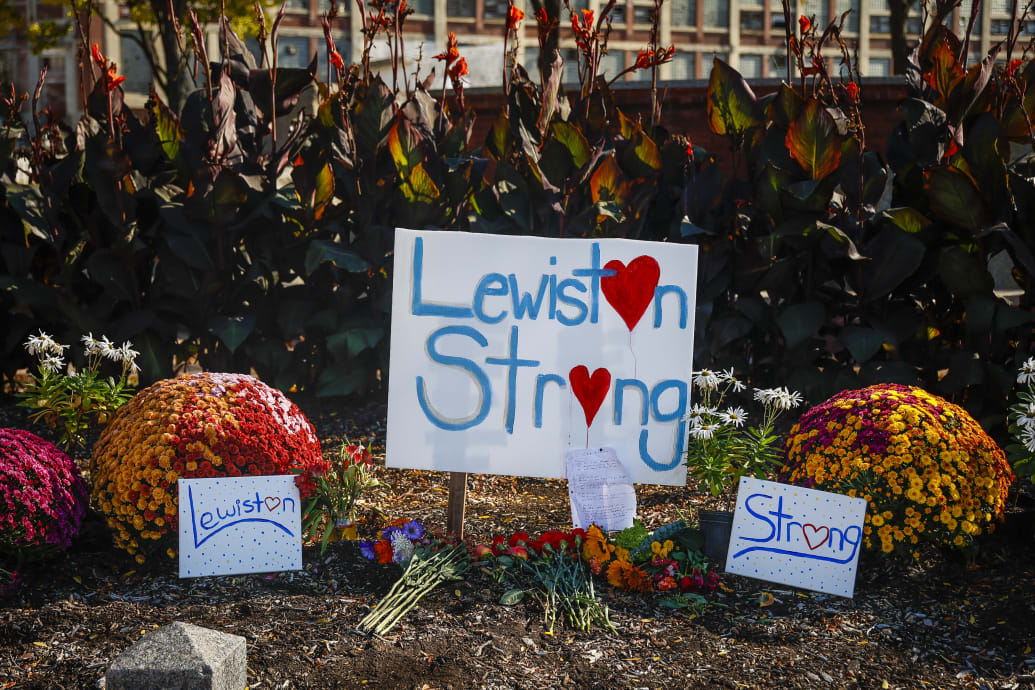 A photo including a Lewiston's strength sign along with a Bonquet of Flowers
