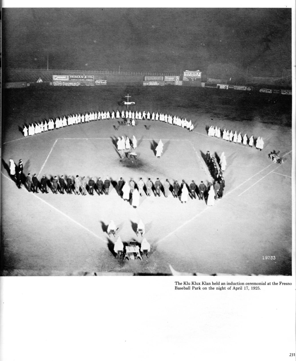 A KKK meeting is held at a ballpark
