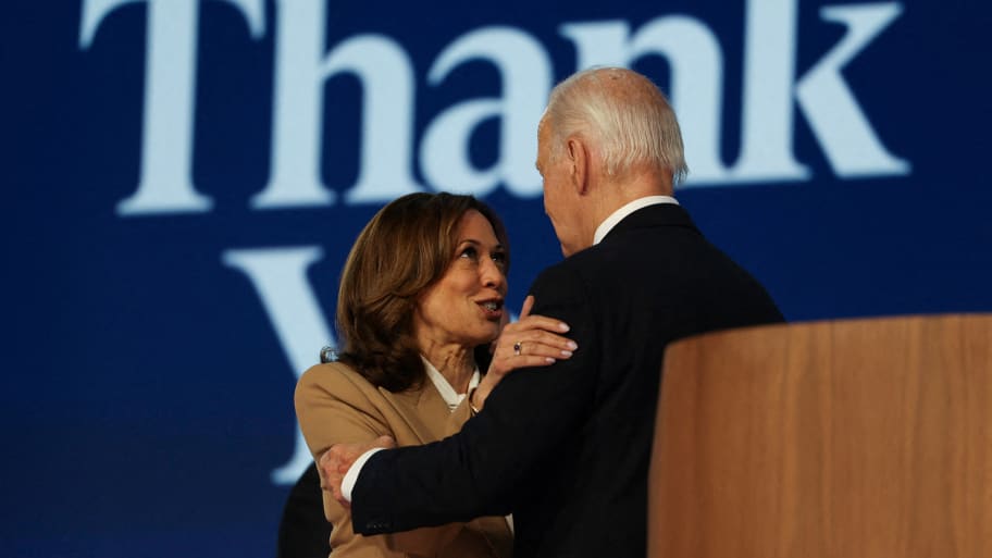 Democratic presidential candidate and U.S. Vice President Kamala Harris and U.S. President Joe Biden embrace on stage during Day one of the Democratic National Convention (DNC) in Chicago, Illinois, U.S., August 19, 2024. 