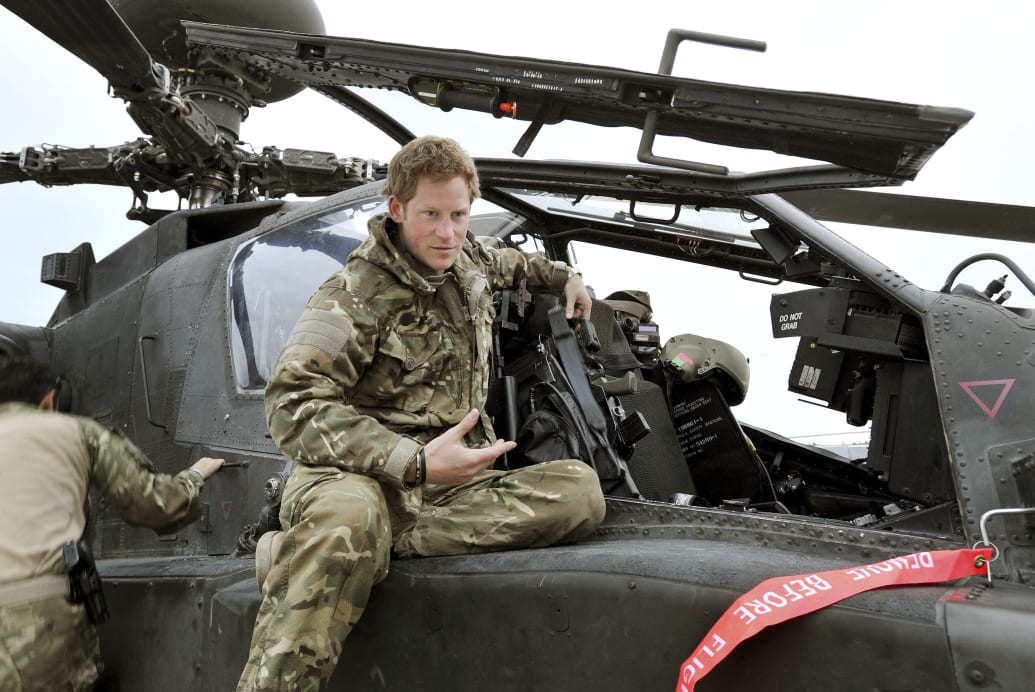Prince Harry carries out a pre-flight check to his Apache helicopter in Camp Bastion, southern Afghanistan in this photograph taken December 12, 2012, and released January 21, 2013.