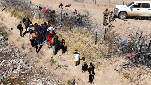 Migrants attempting to cross the North American side of the border between El Paso and Ciudad Juarez, Mexico.
