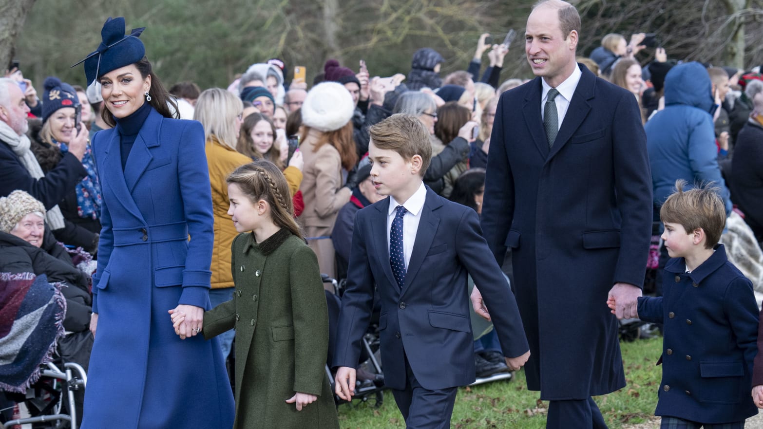 Catherine, Princess of Wales (L) and Prince William, Prince of Wales (2nd R) with Prince Louis of Wales (R), Prince George of Wales (C) and Princess Charlotte of Wales (2nd L) attend the Christmas Day service at St Mary Magdalene Church on December 25