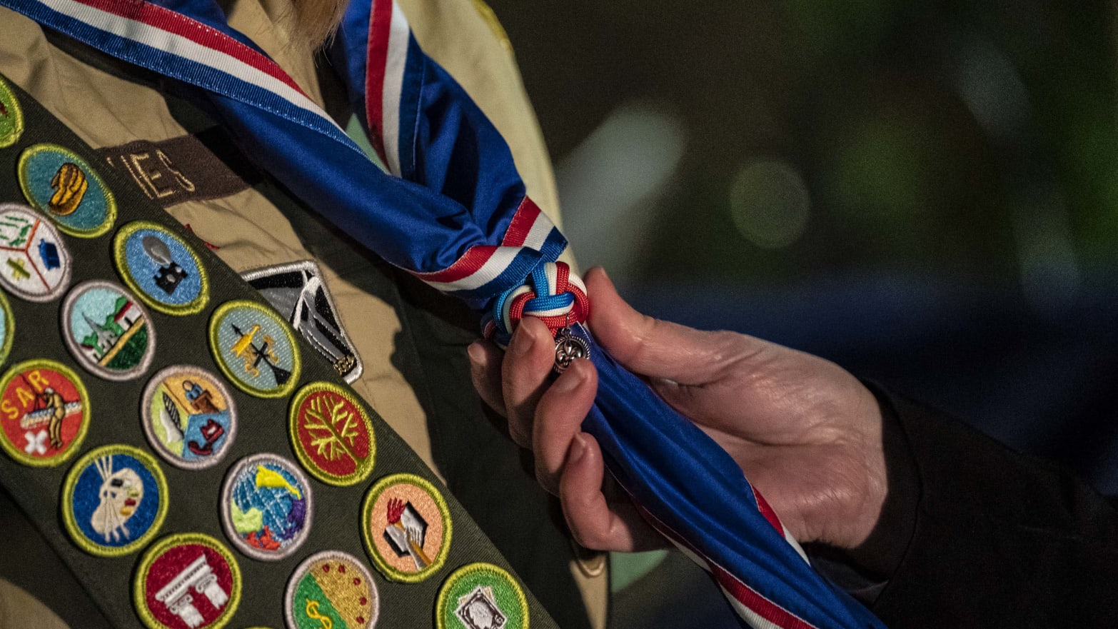 A scout receives her blue Eagle Scout neckerchief during a ceremony recognizing the inaugural class of female Eagle Scouts on Feb. 8, 2021, in Tacoma, Washington.