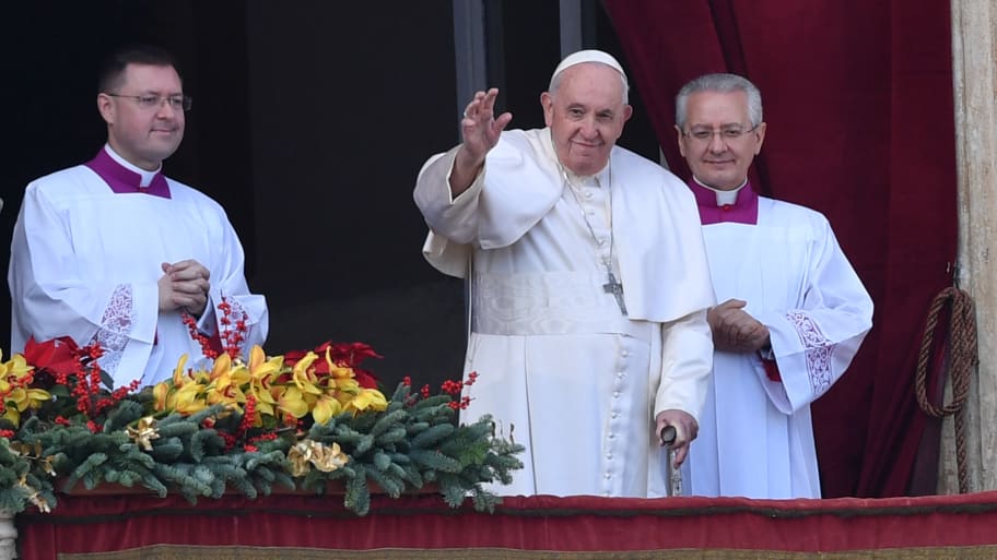 Pope Francis greets the audience at St. Peter's Basilica before his annual Christmas speech.