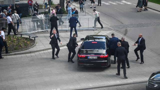 Security officers move Slovakia Prime Minister Robert Fico in a car after a shooting incident, after a Slovak government meeting in Handlova, Slovakia, May 15, 2024. 