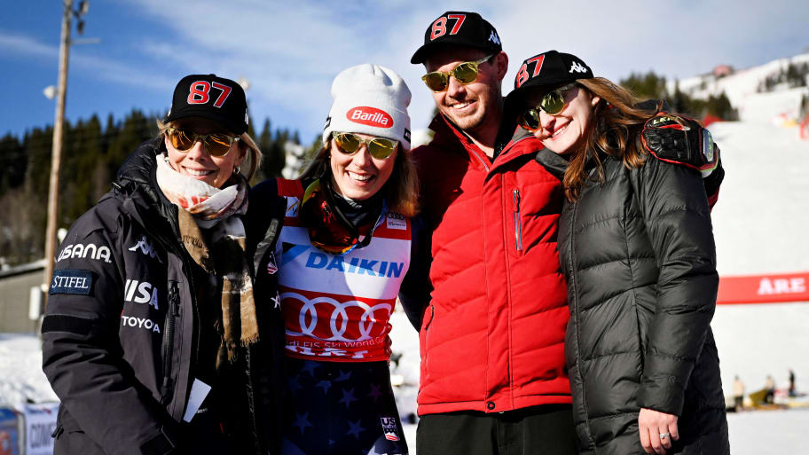 Mikaela Shiffrin standing with her mother, brother, and sister-in-law following her record-setting win.