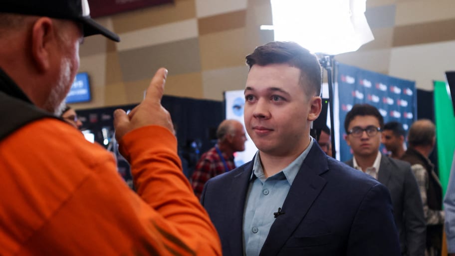 A member of the media interviews Kyle Rittenhouse during a right-wing gathering known as America Fest, an event organized by Turning Point USA, in Phoenix, Arizona. 