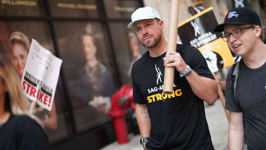 Stephen Amell joins SAG-AFTRA members as they maintain picket lines across New York City on August 11, 2023 in New York City. 
