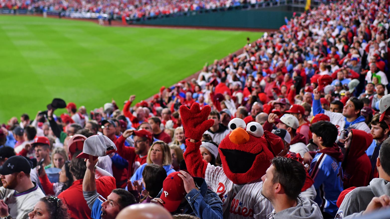 Phillies fans pack into the stands for a playoff baseball game.