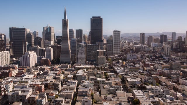 The downtown San Francisco skyline is viewed from Telegraph Hill and Coit Tower.